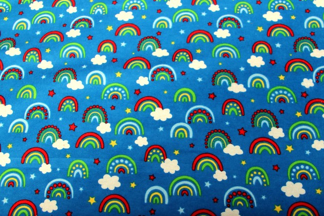 Bright Rainbows on Blue Printed Flannelette