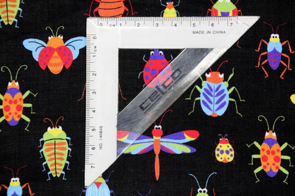 Bright Bugs on Black Cotton