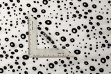 Black Flocked Circles on White Printed Polyester